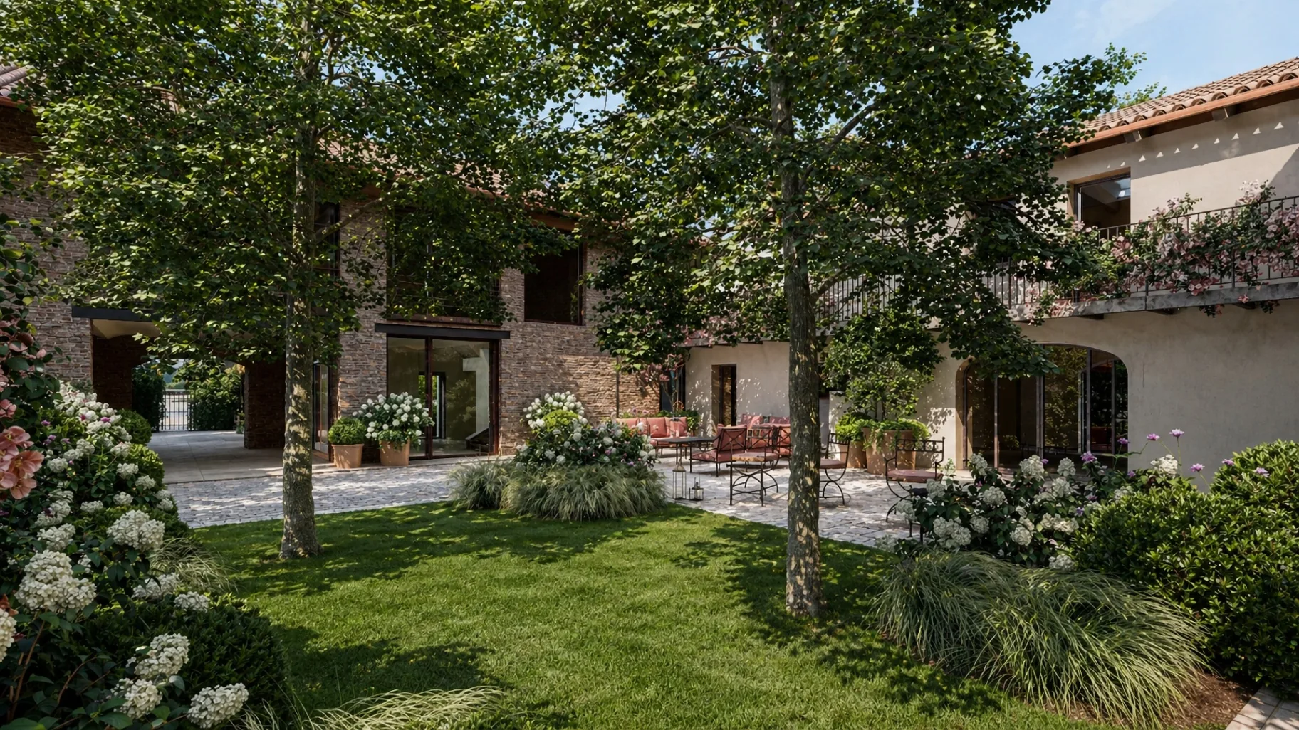 Inner courtyard with hydrangeas, mature trees, and lounge seating at Borgo Castellengo