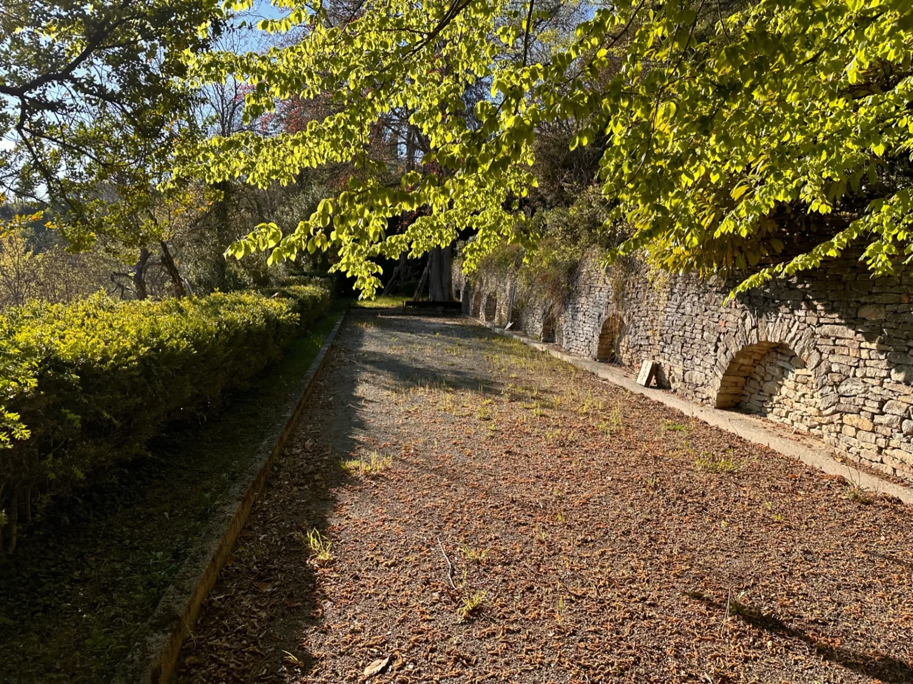 Private trail along the historic stone wall at Borgo Castellengo