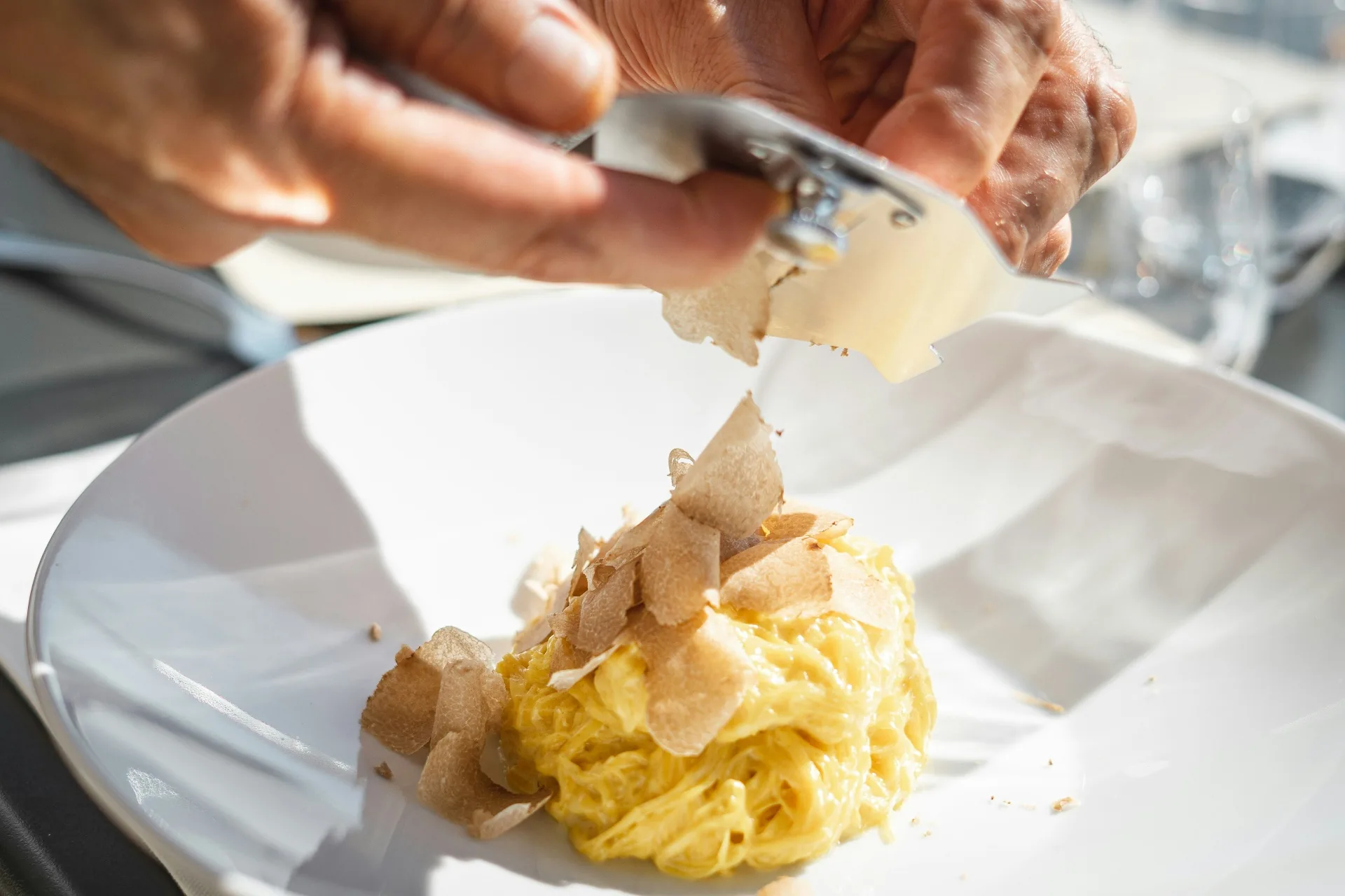 Truffle shaved over fresh Tajarin pasta